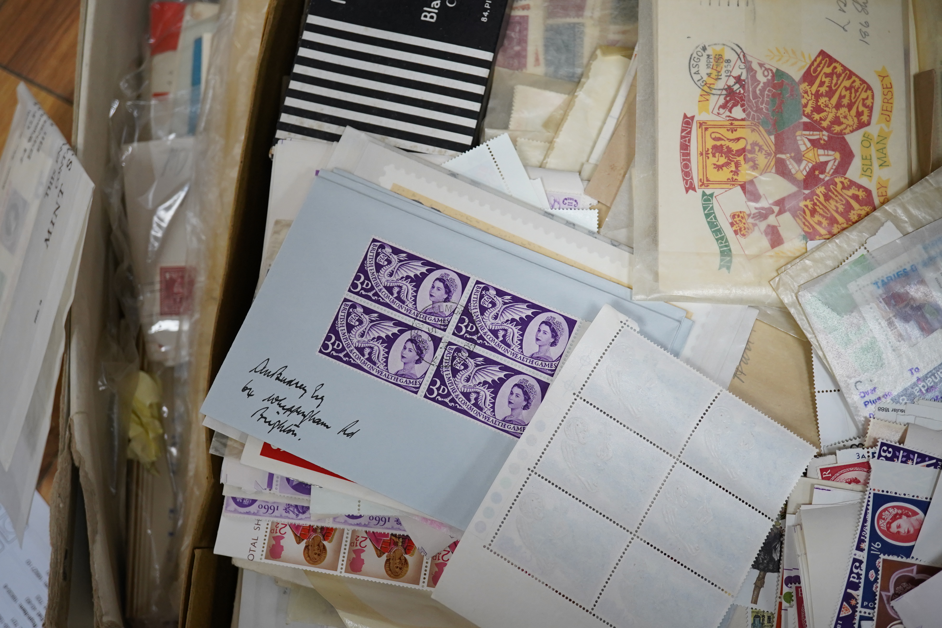 A large quantity of mint stamps, booklets, autograph albums, a sketch book, photos, etc. (2 boxes). Condition - mixed, poor to good